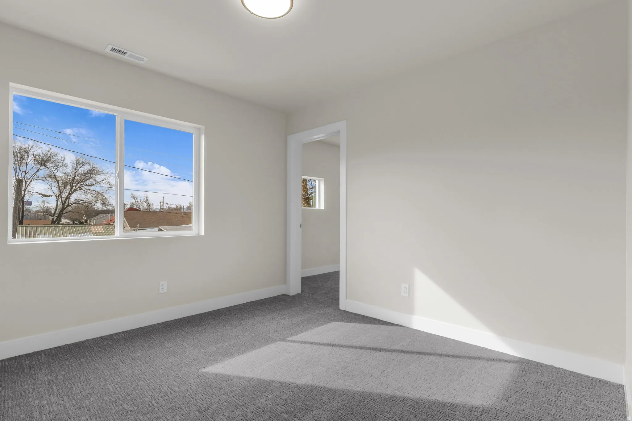 Unfurnished bedroom featuring carpet and baseboards