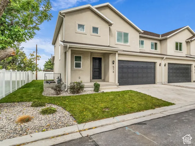 Neutral-toned stucco exterior with multiple windows