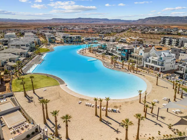 Community pool with a mountain view and a patio area