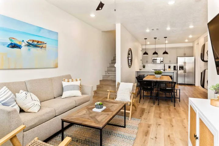 Living area featuring light wood finished floors, recessed lighting, and ceiling fan