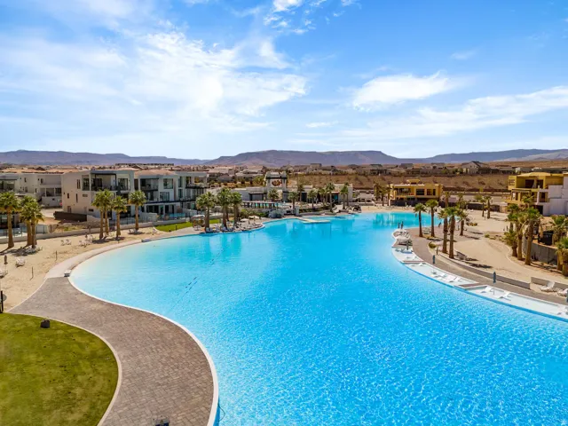 Community pool with a mountain view and a patio area
