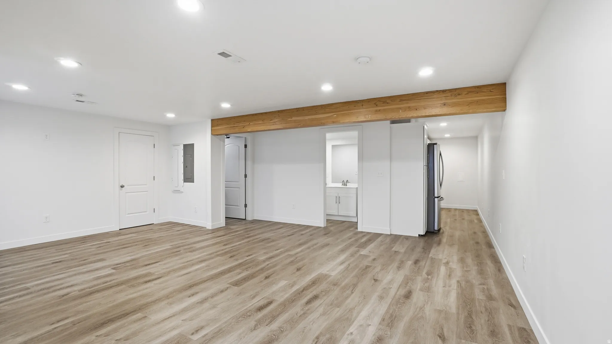 Unfurnished living room with recessed lighting and light wood-style floors