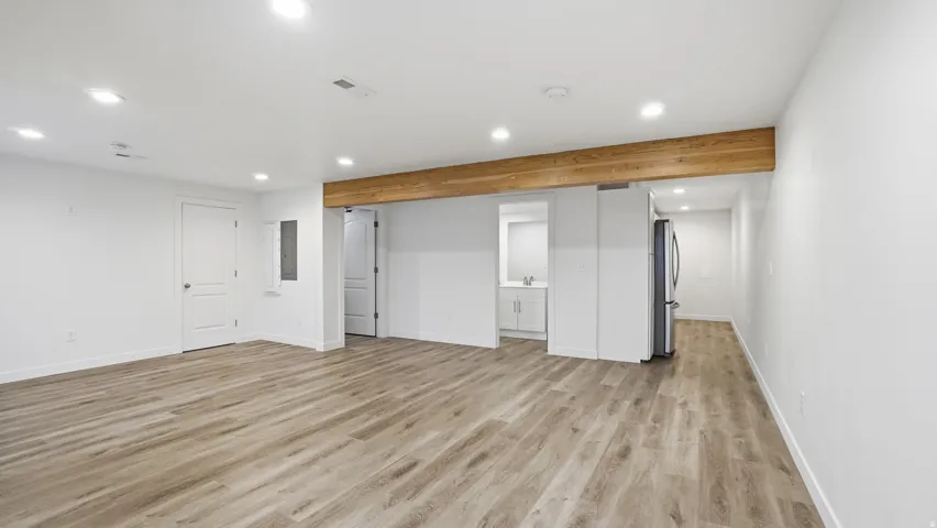 Unfurnished living room with recessed lighting and light wood-style floors