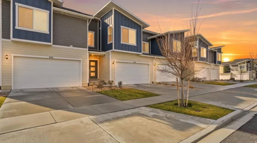 Modern home featuring board and batten siding, concrete driveway, and a garage