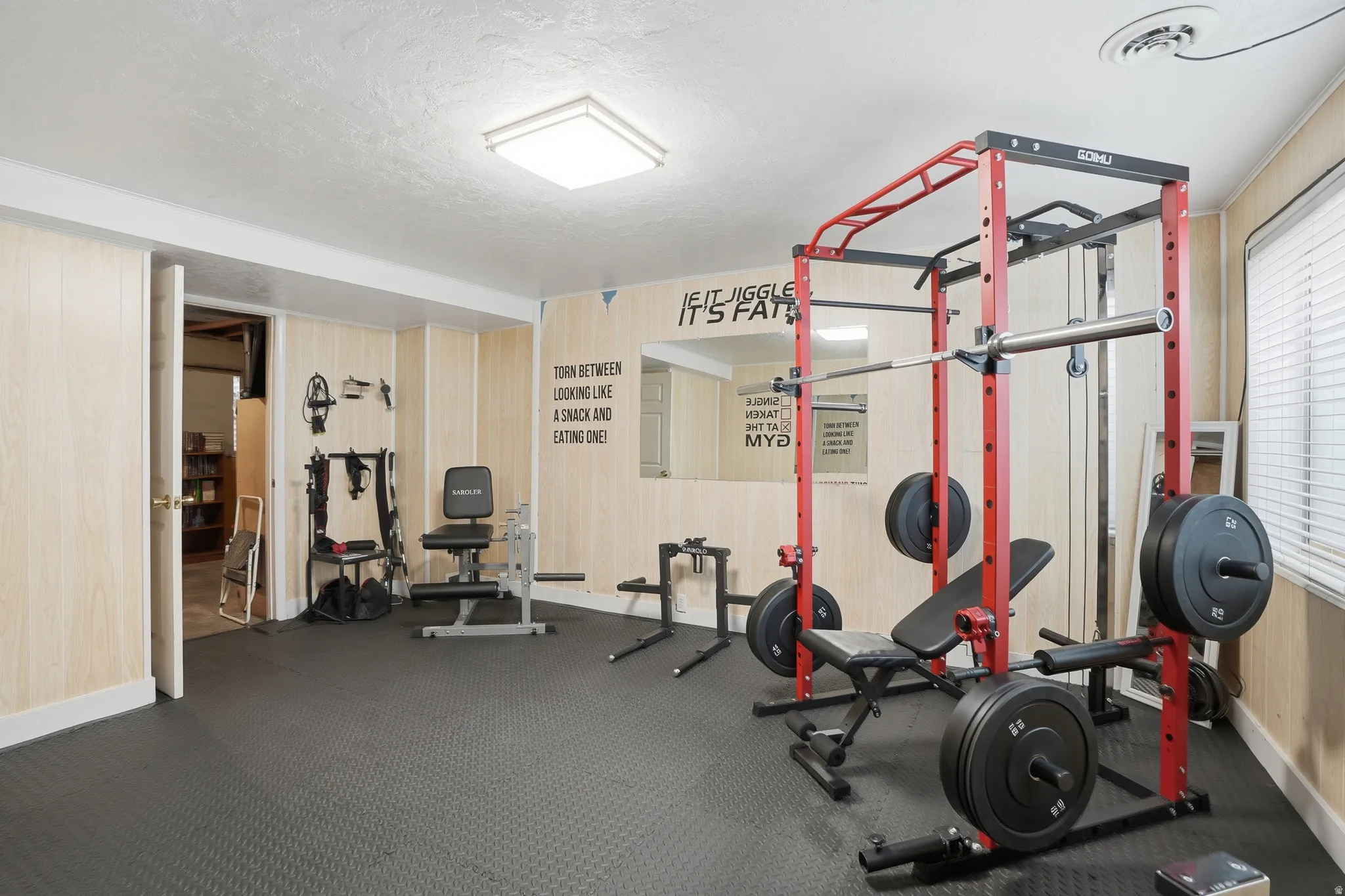 Exercise area with a textured ceiling