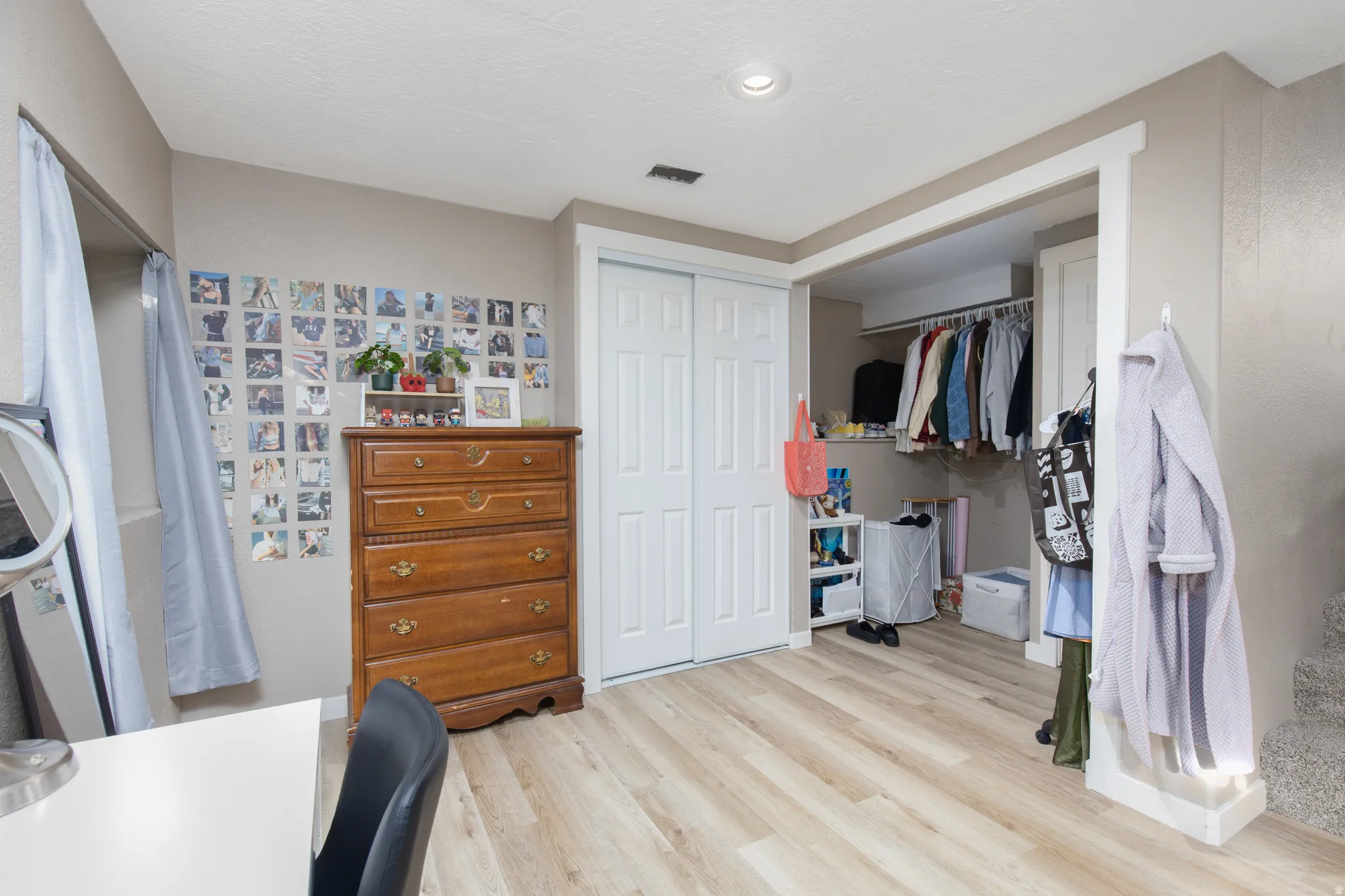Bedroom with a closet and light wood-type flooring