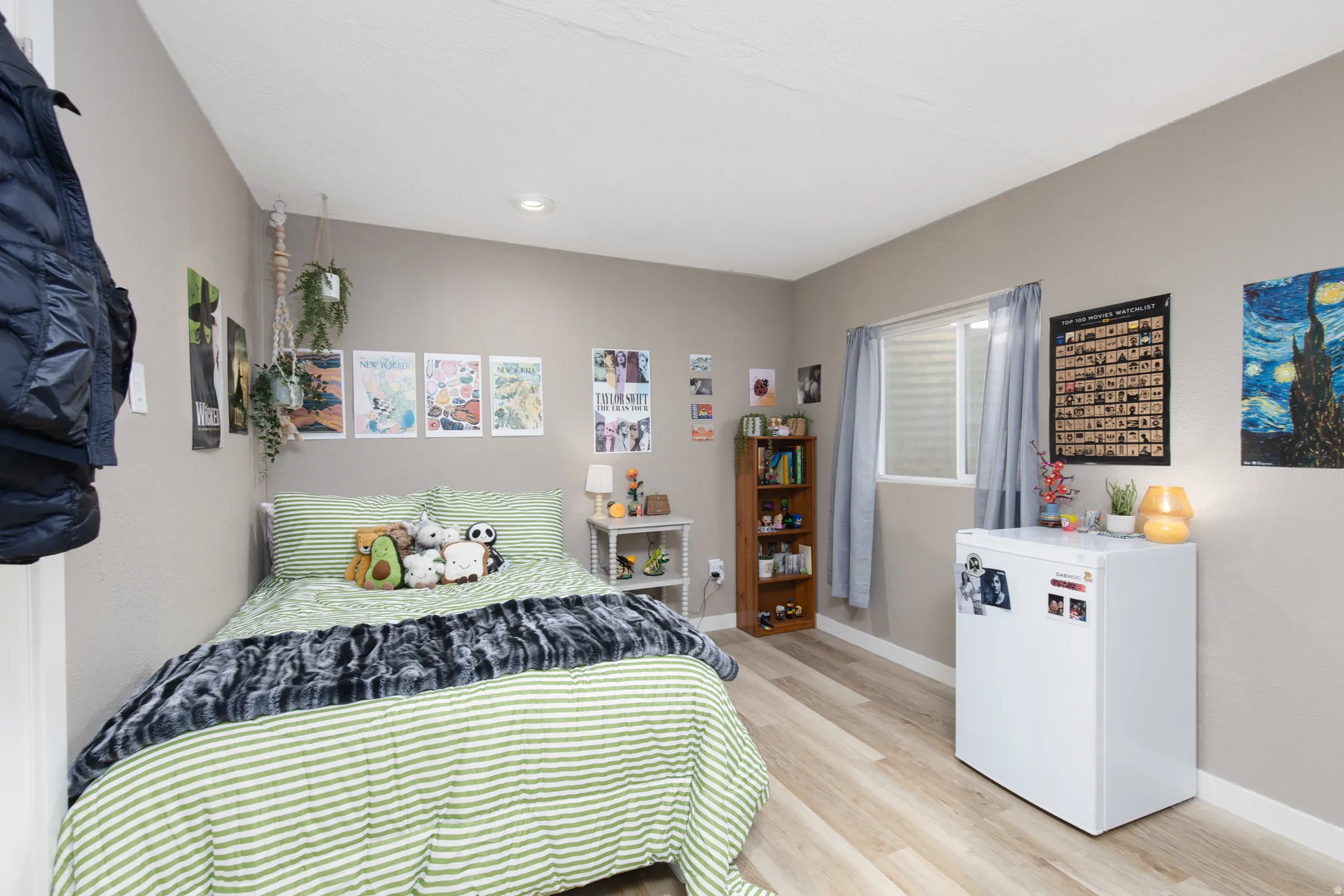 Bedroom featuring baseboards and light wood finished floors