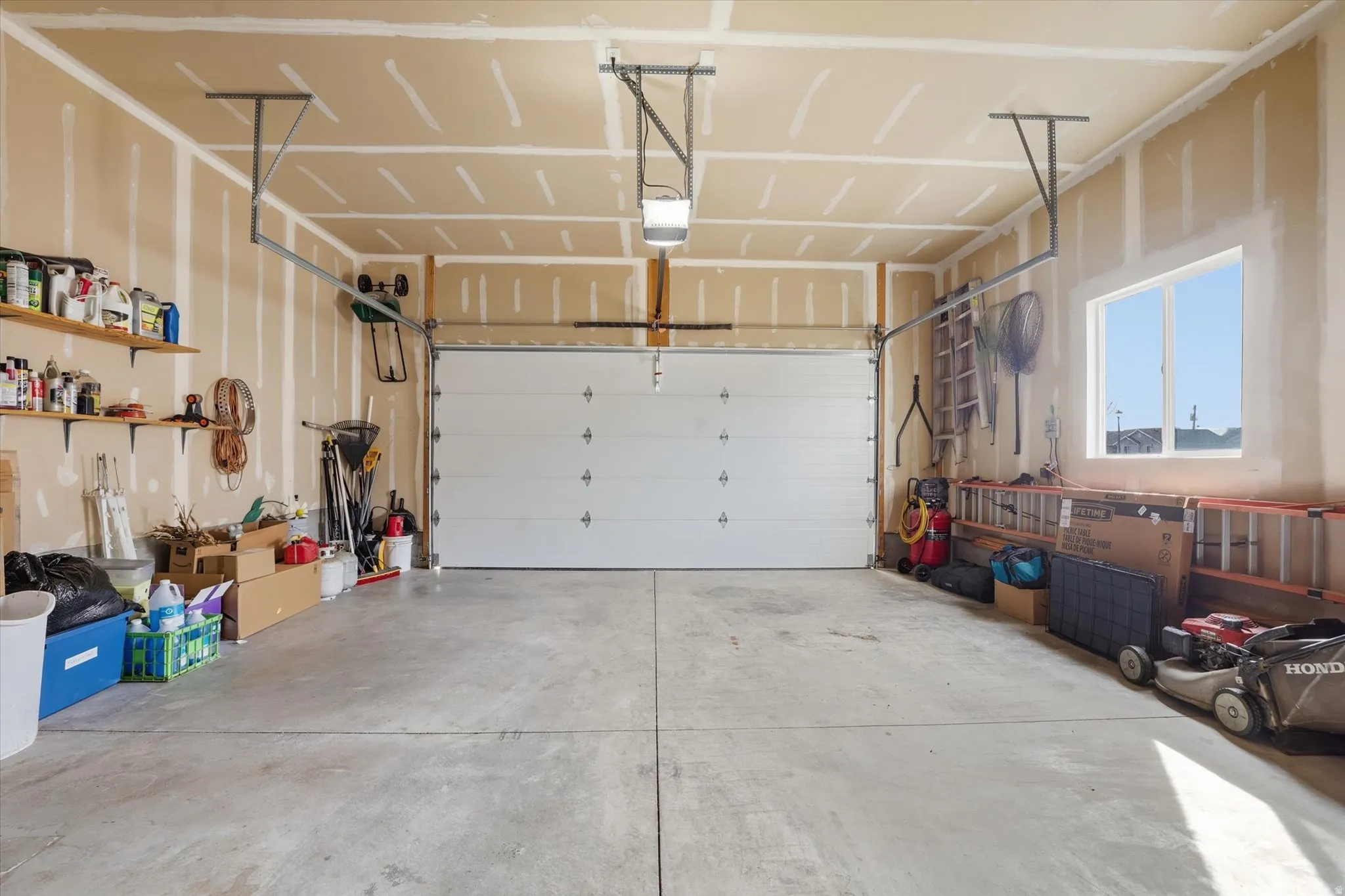 Garage featuring a garage door opener