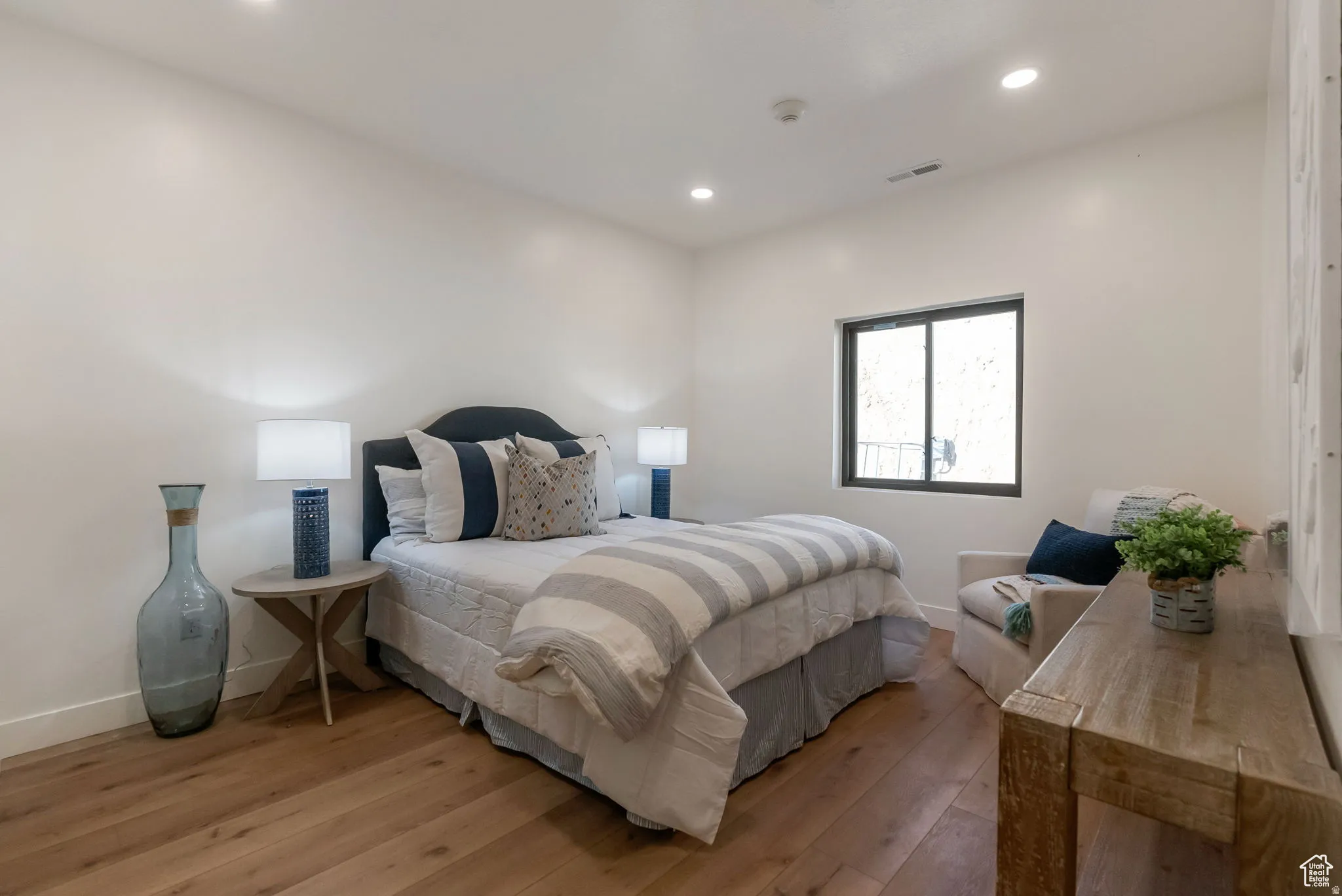 Bedroom featuring wood-type flooring and recessed lighting