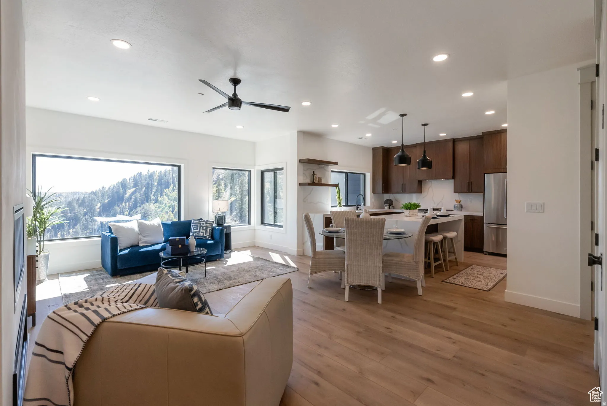 Living room featuring recessed lighting, light wood-type flooring, and ceiling fan