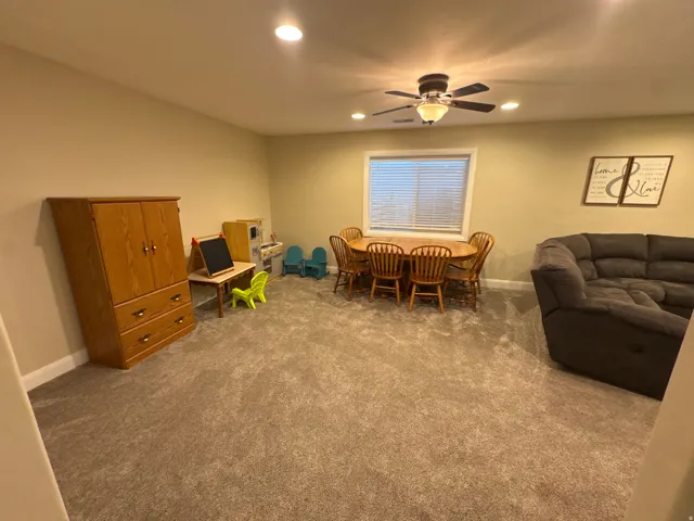 Dining area featuring ceiling fan, carpet floors, and recessed lighting