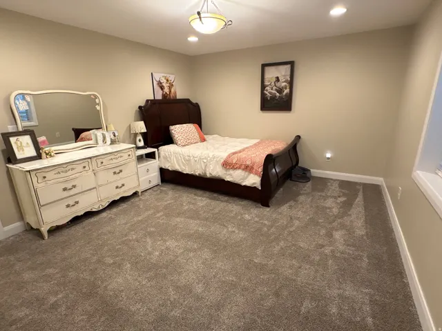 Bedroom featuring dark colored carpet and recessed lighting