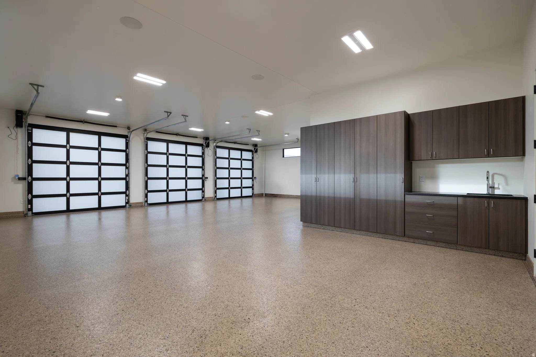 Oversized Garage with Heat & A/C, Cabinetry, Two 220V Outlets, and Prewiring for Solar