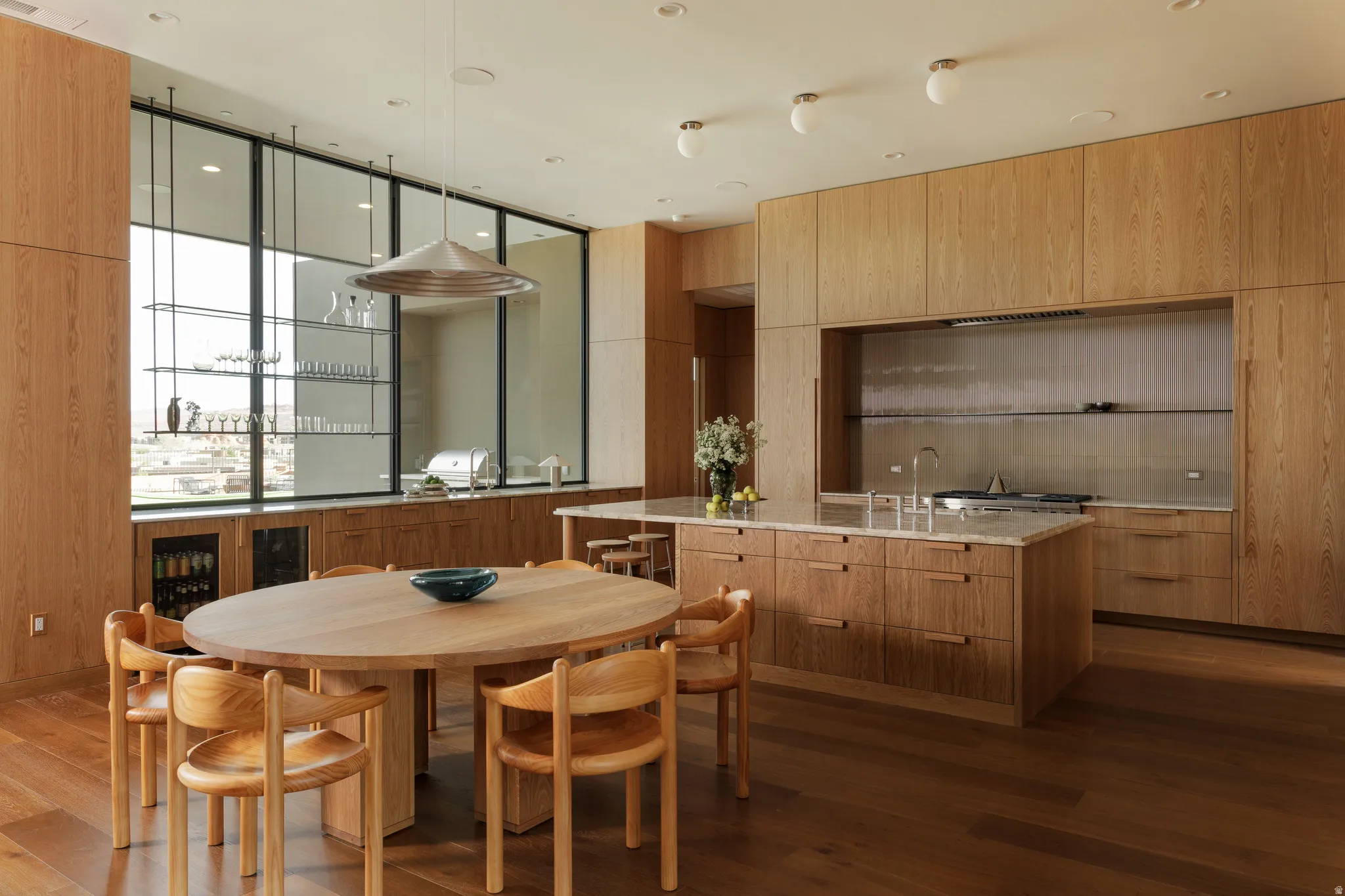 Oversized Kitchen with Warm Wood Cabinets and Marble Countertops