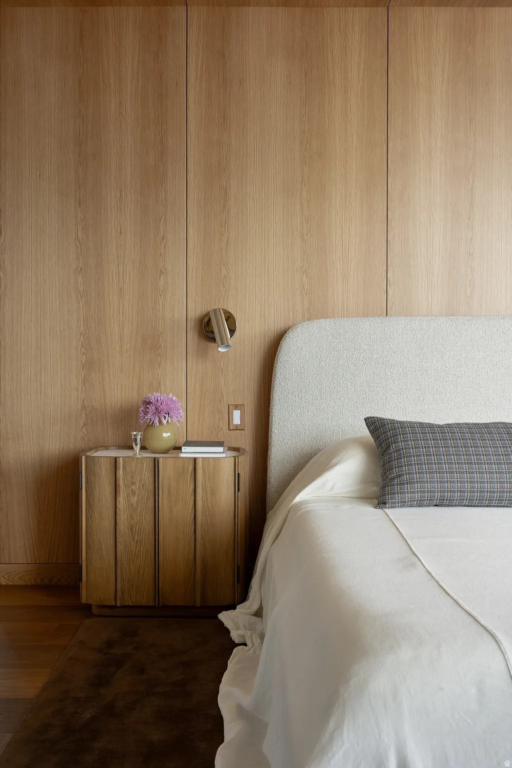 Sconces and Wood Paneling in the Primary Bedroom