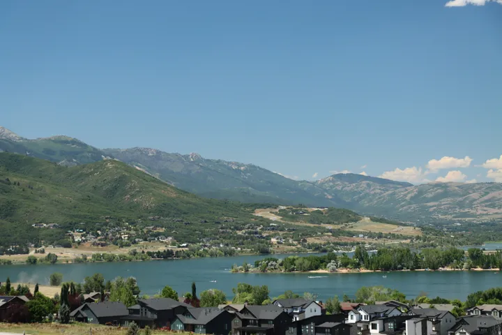Water view with mountains and nearby suburban area