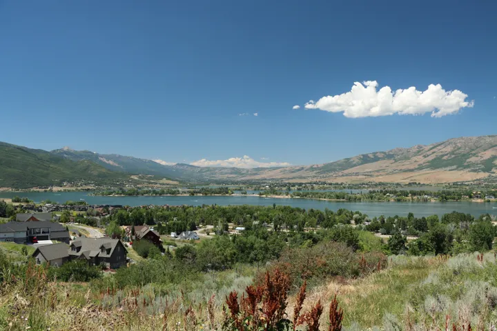 View of mountain backdrop with a nearby body of water
