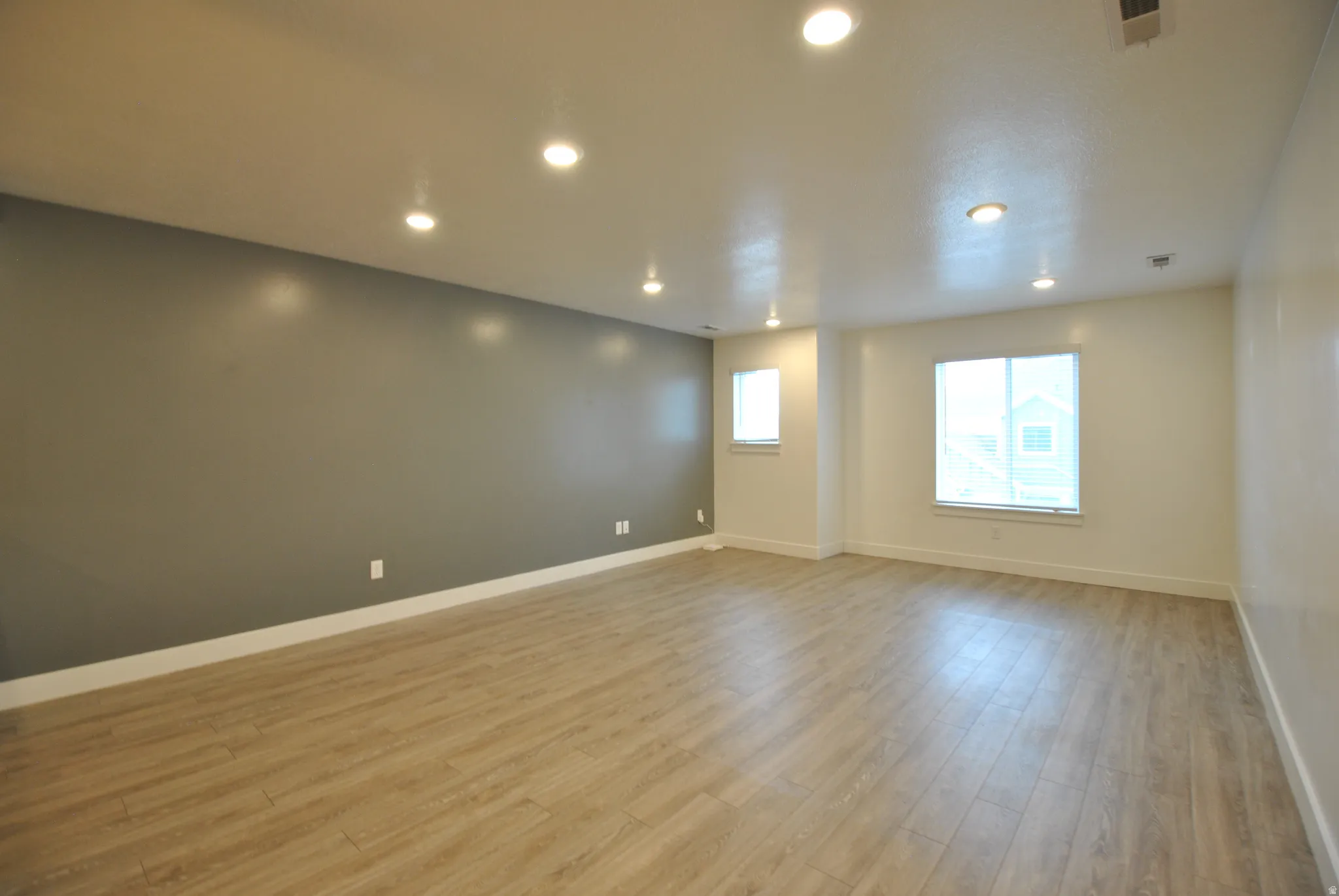 Great room featuring recessed lighting and light wood finished floors