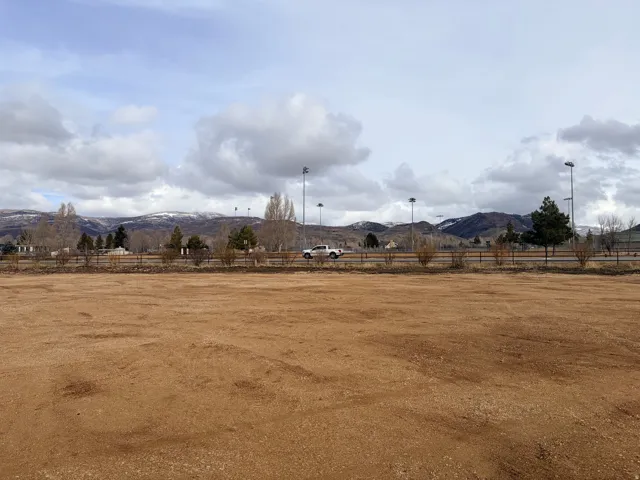View of yard featuring a rural view and a mountain view