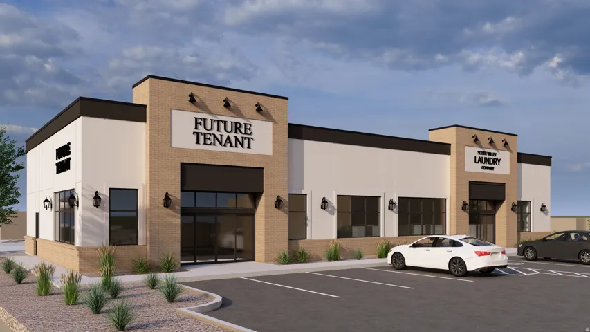 View of commercial location featuring uncovered parking