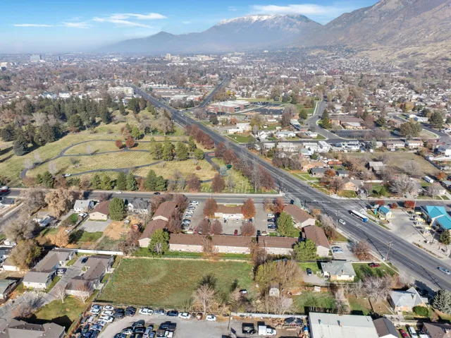 Aerial overview of property's location with mountains and nearby suburban area