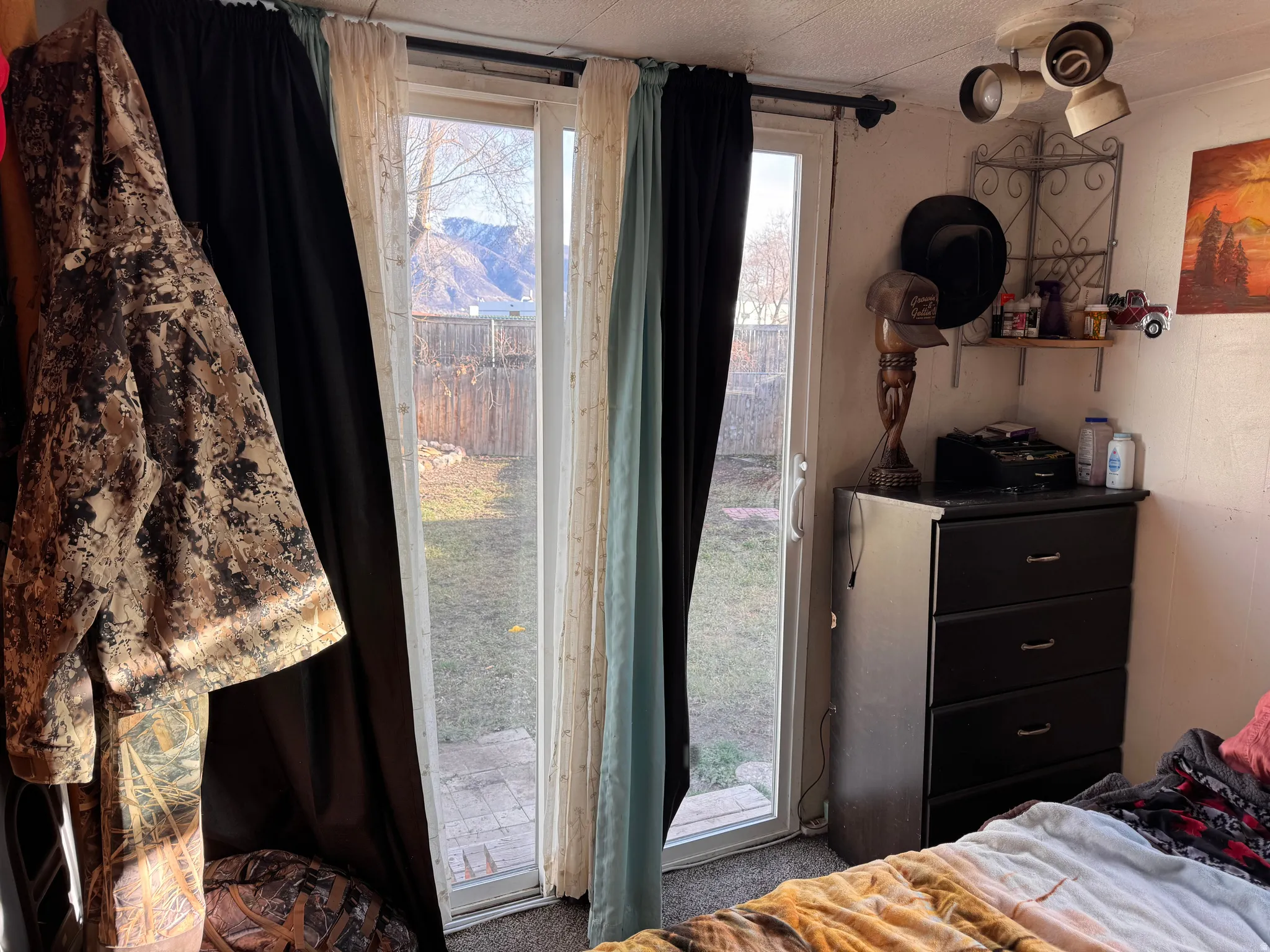 Bedroom with carpet and access to outside