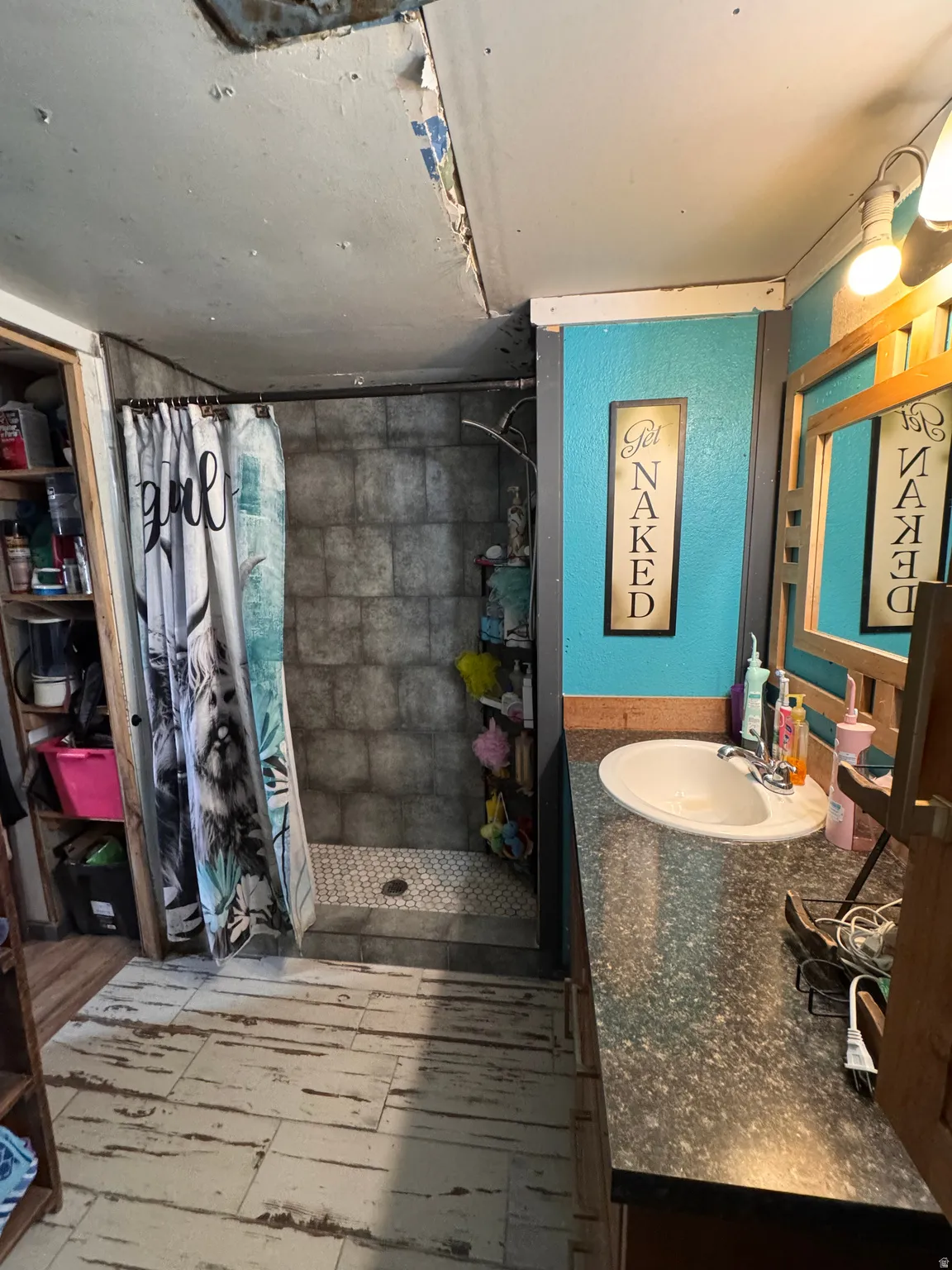 Bathroom with a shower stall and vanity