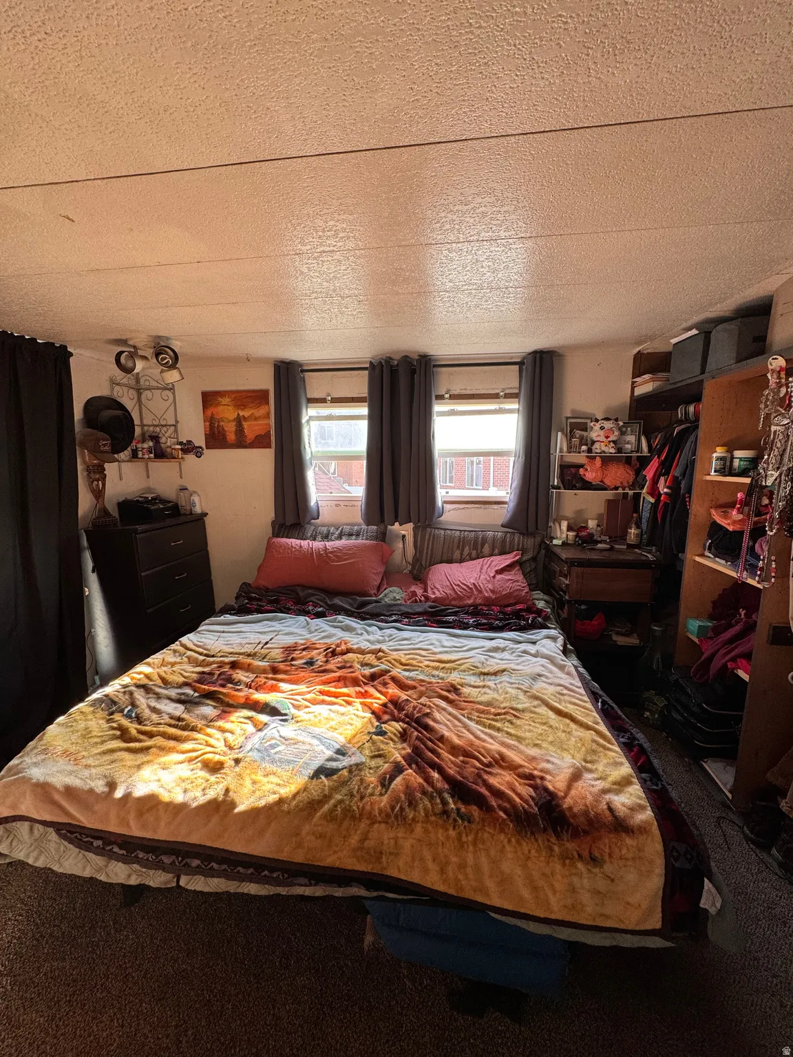 Bedroom featuring a textured ceiling