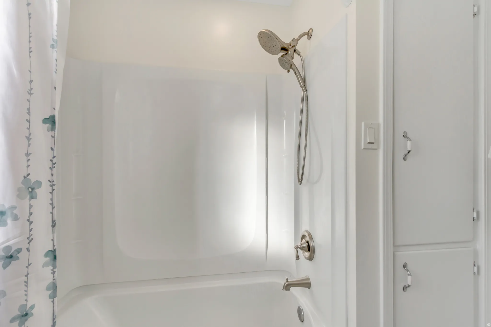 Full bathroom with shower / bath combo with shower curtain