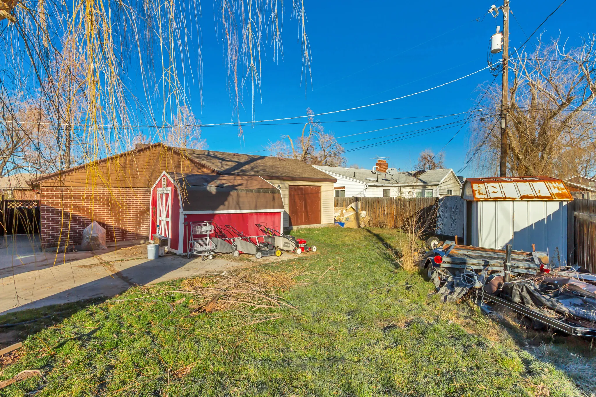Fenced yard featuring a shed