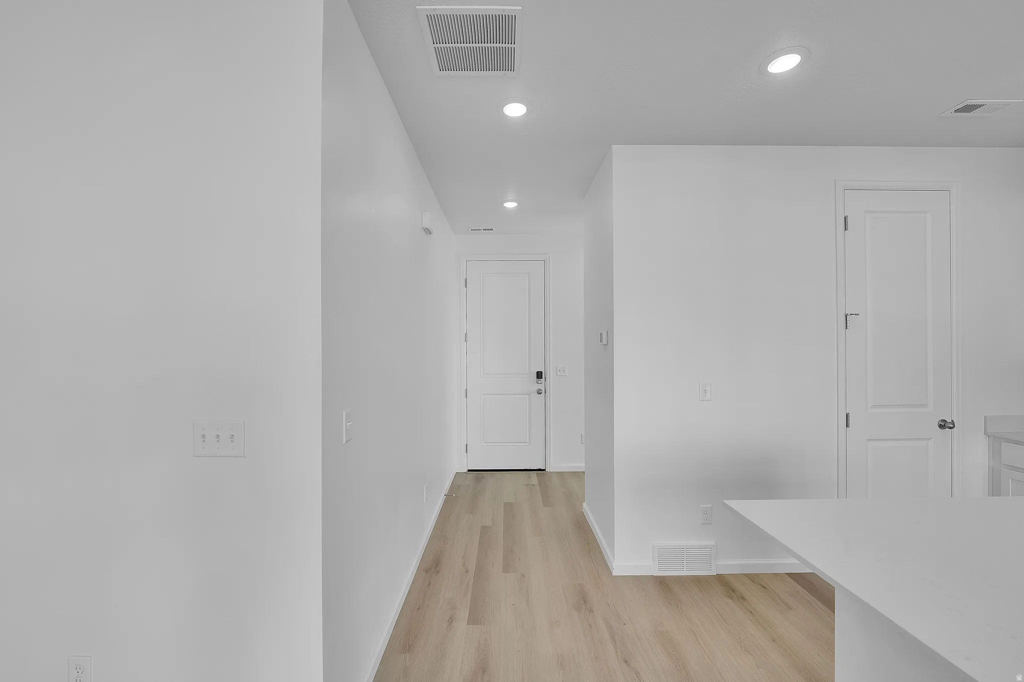 Corridor featuring recessed lighting and light wood-style flooring
