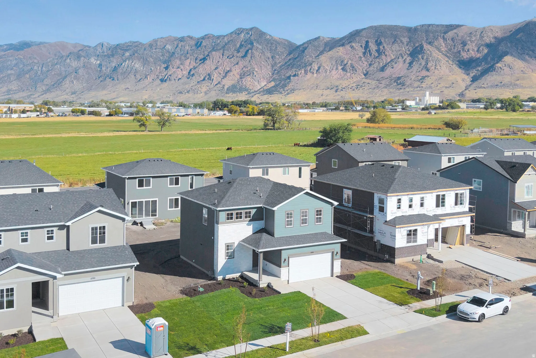 Aerial perspective of suburban area with a mountainous background