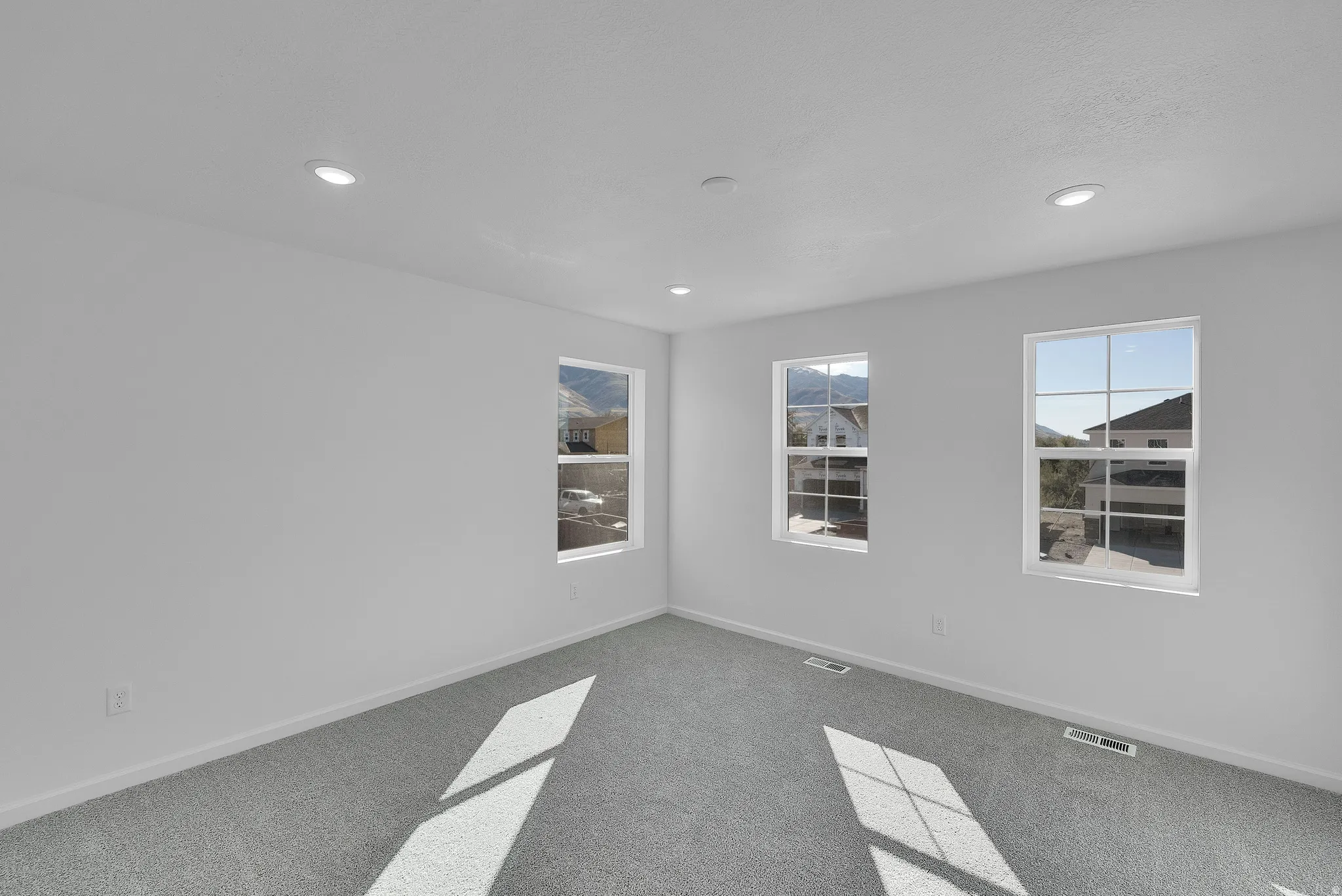 Unfurnished room featuring carpet floors and recessed lighting