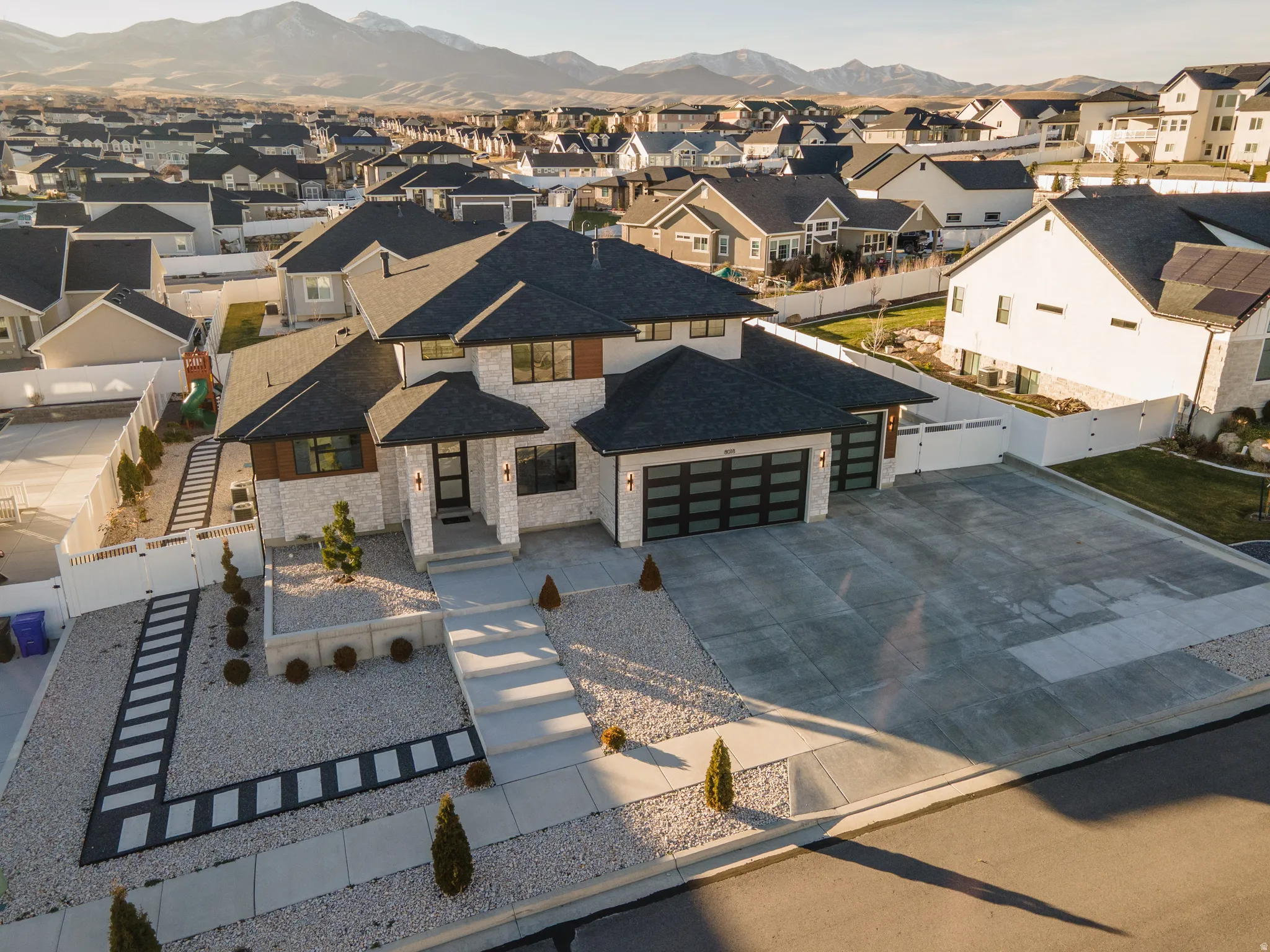 Aerial view of residential area featuring mountains