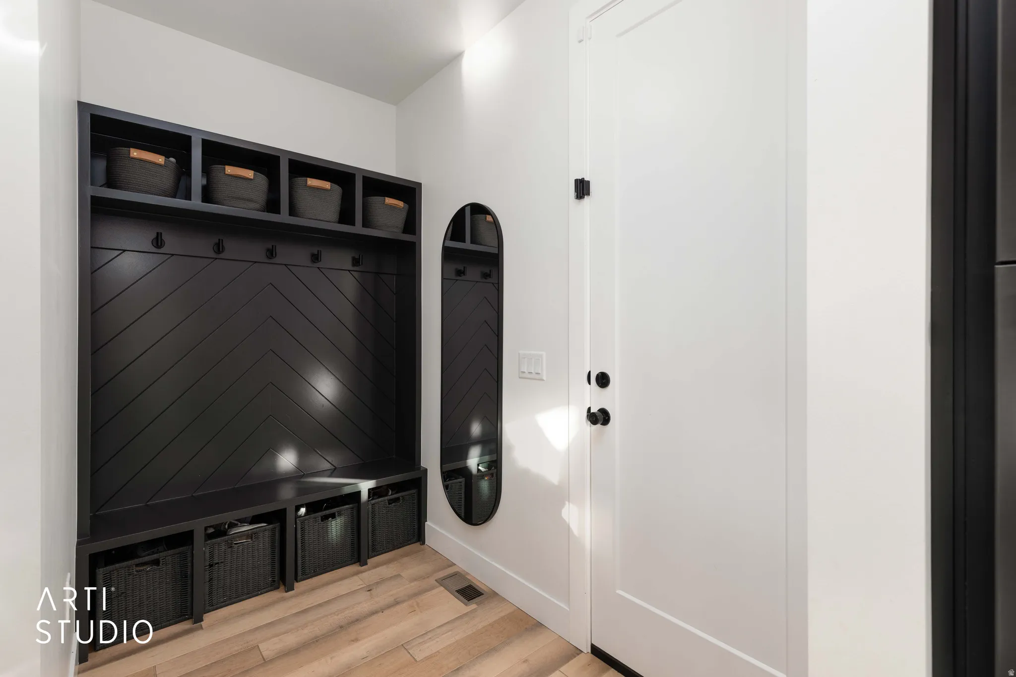 Mudroom featuring light wood-type flooring