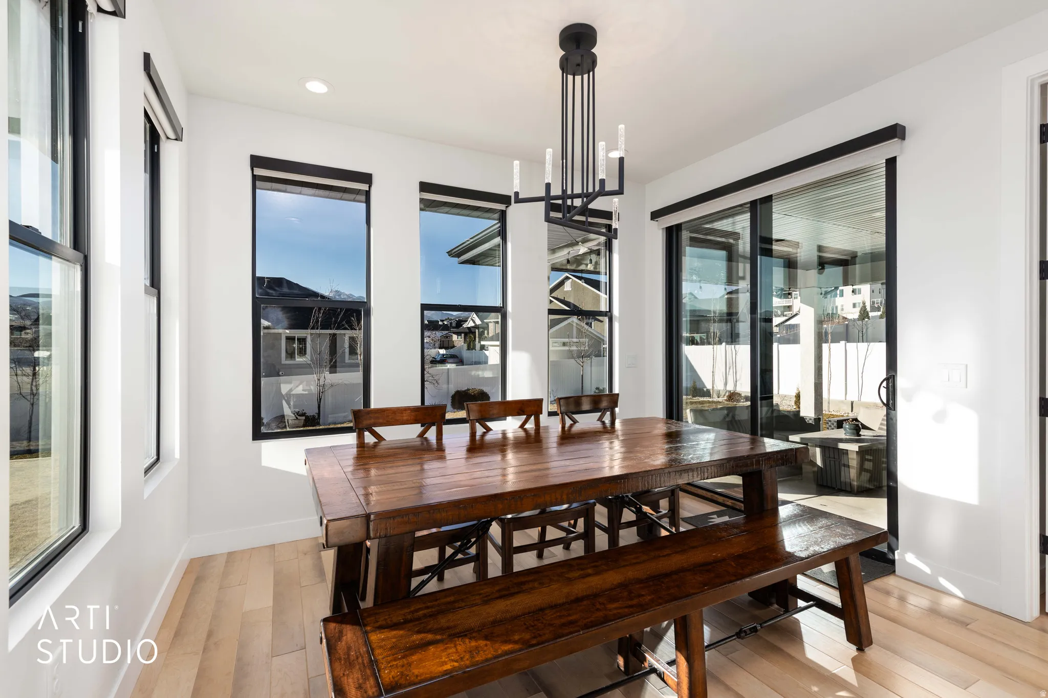 Dining space featuring a chandelier, light wood finished floors, and recessed lighting