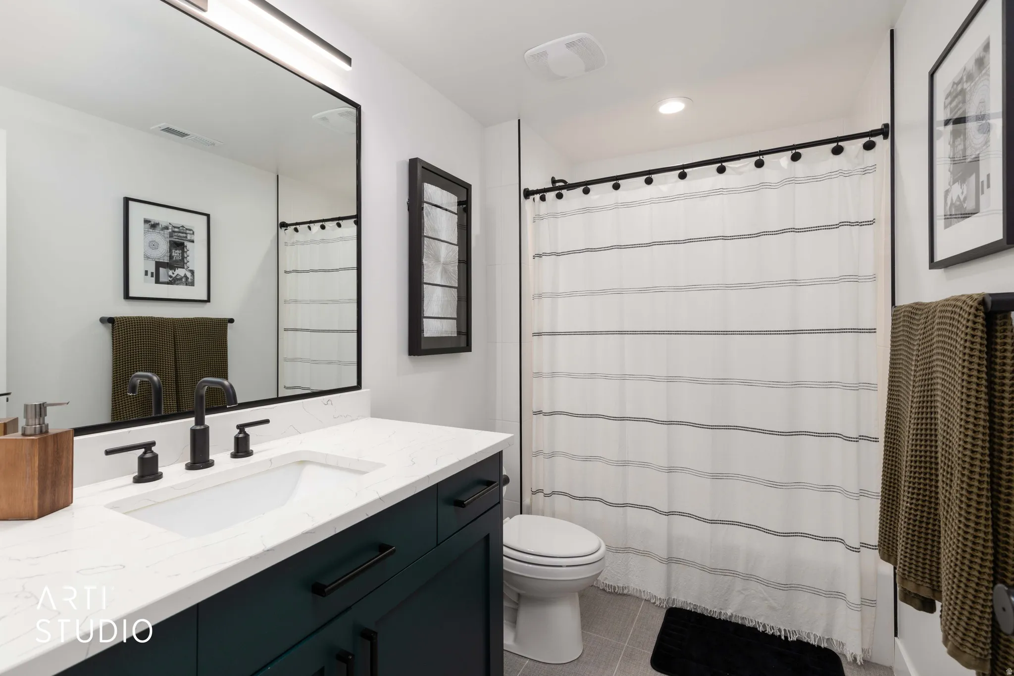 Bathroom featuring vanity and light tile patterned floors