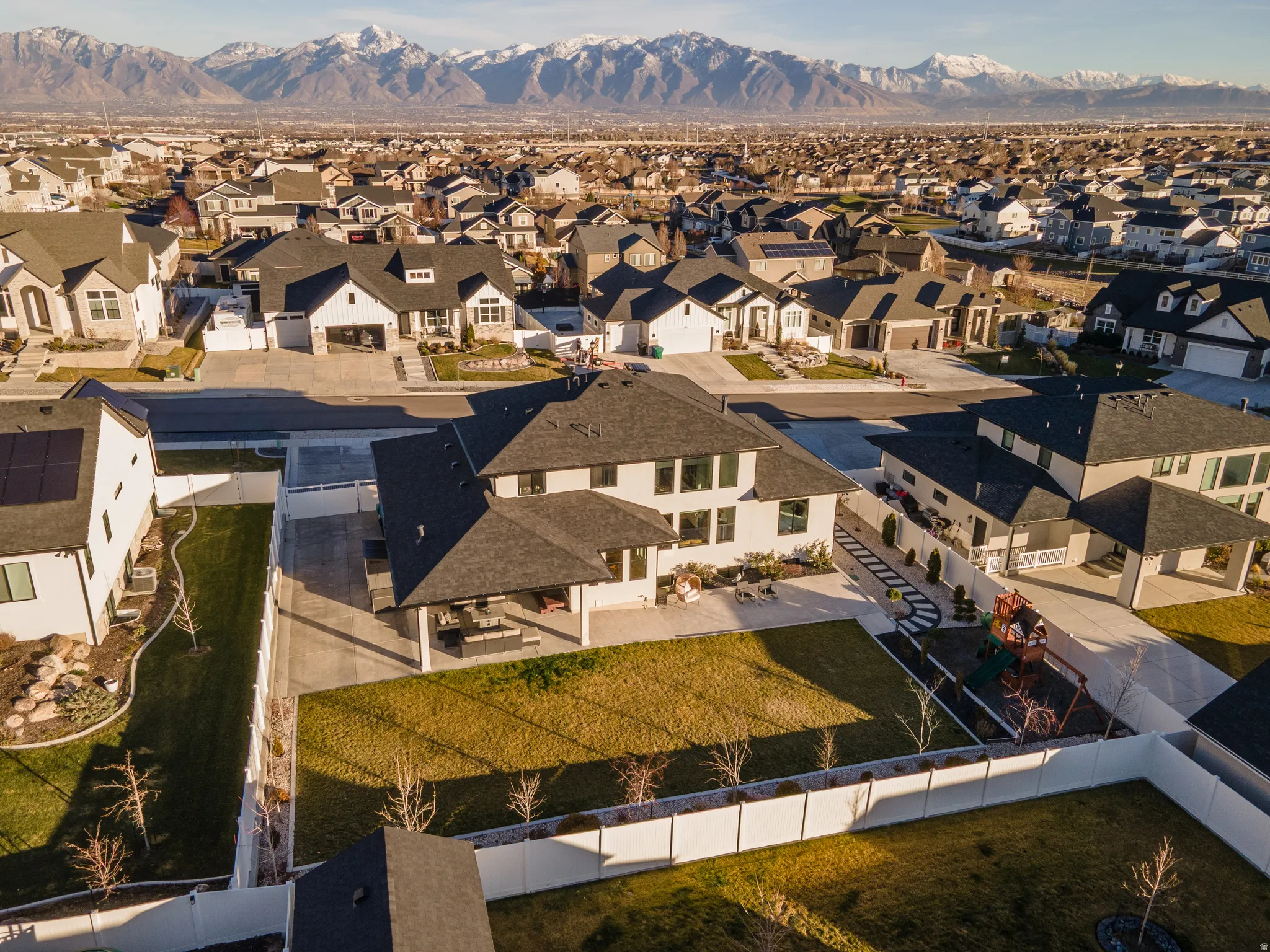 Aerial view of residential area featuring a mountainous background