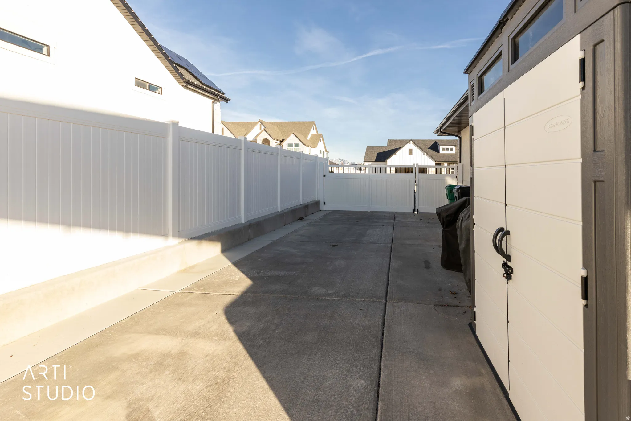 Fenced backyard with a residential view