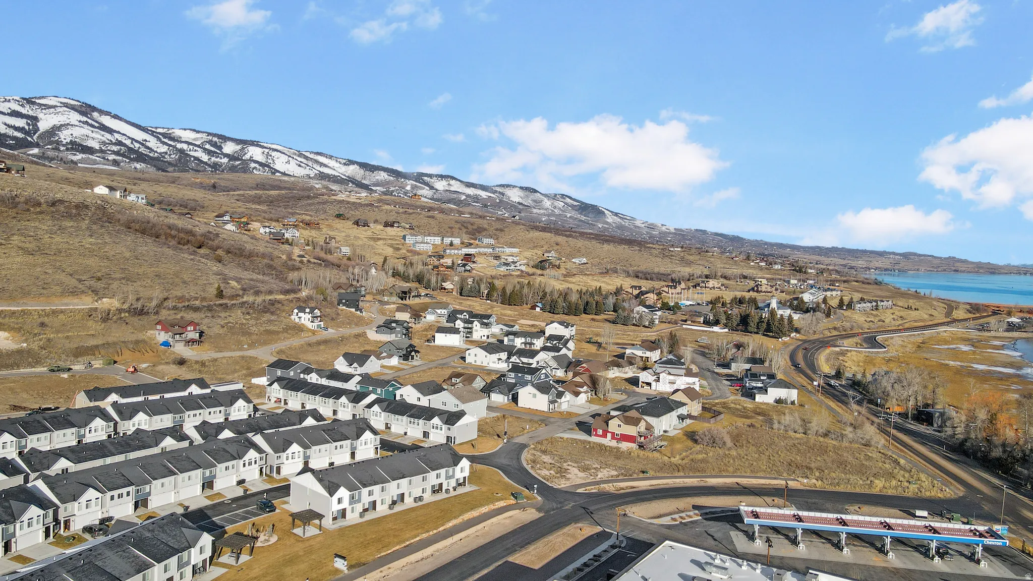 Aerial view of residential area featuring a water and mountain view