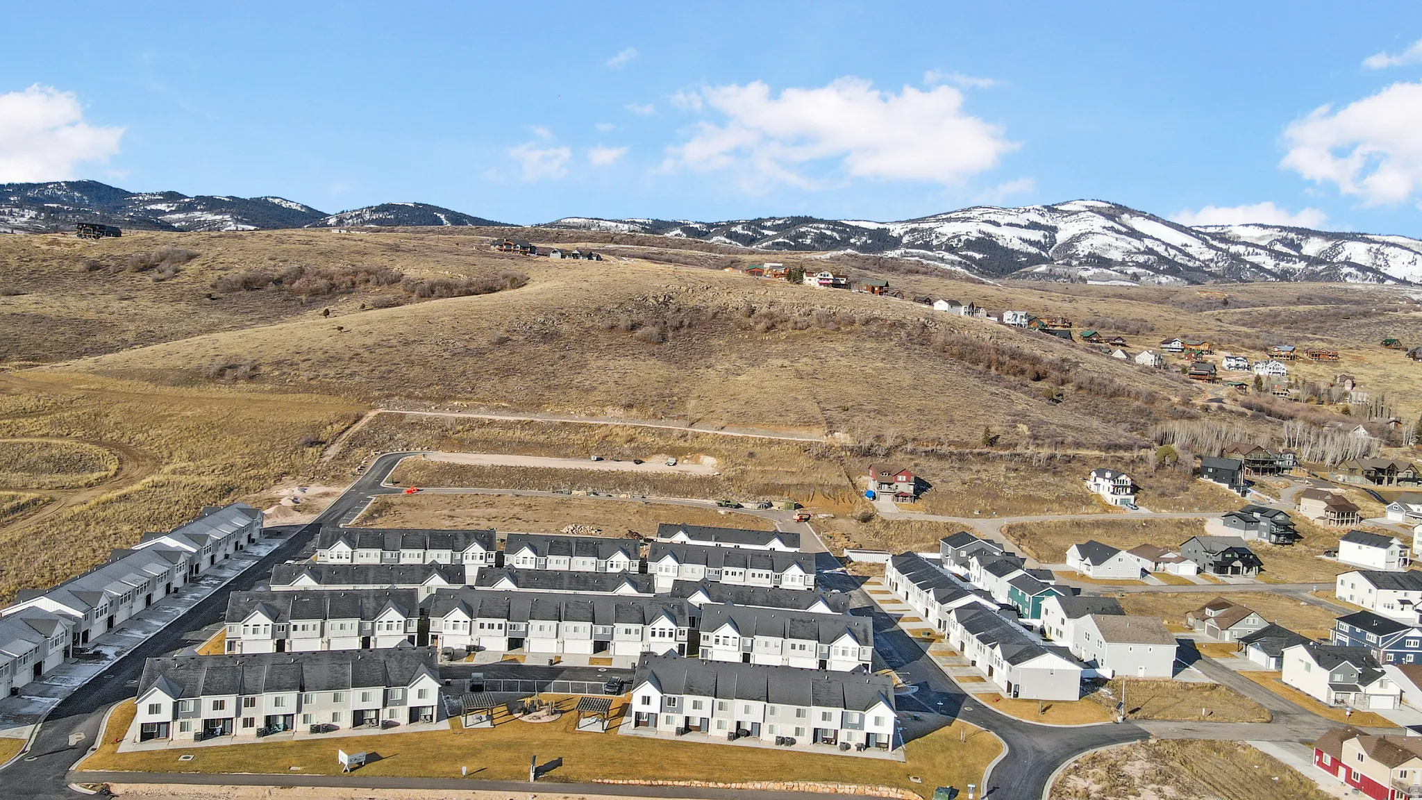 Aerial perspective of suburban area with mountains