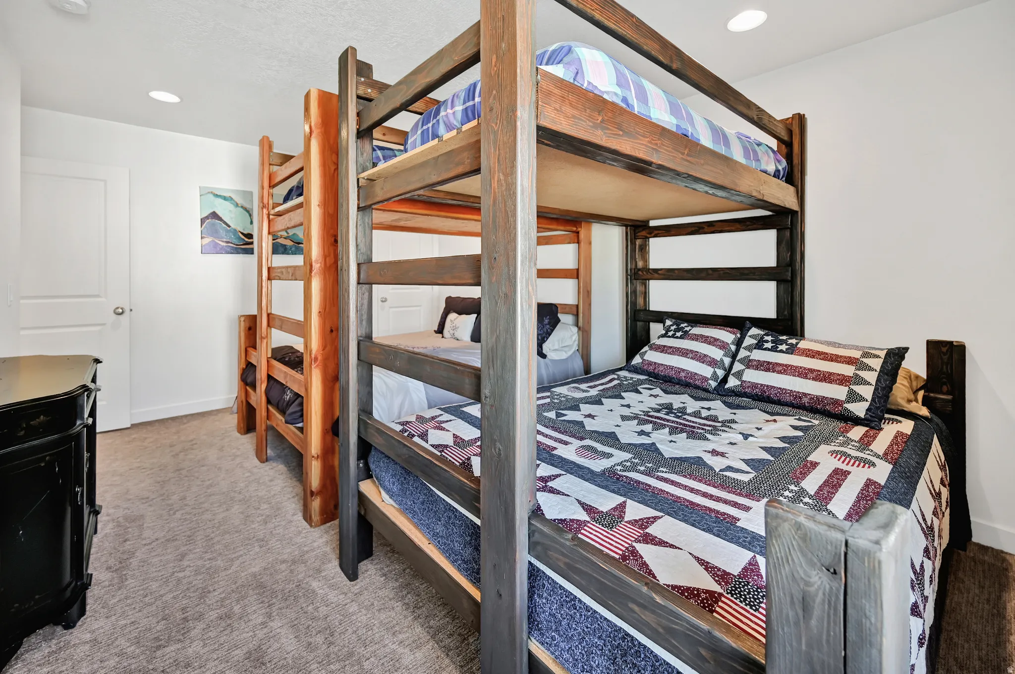 Bedroom with light carpet and recessed lighting