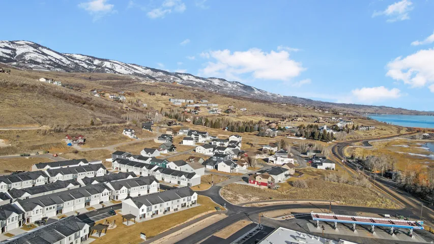 Aerial view of residential area featuring a water and mountain view