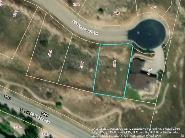 Aerial map of property and surrounding area featuring property boundaries highlighted