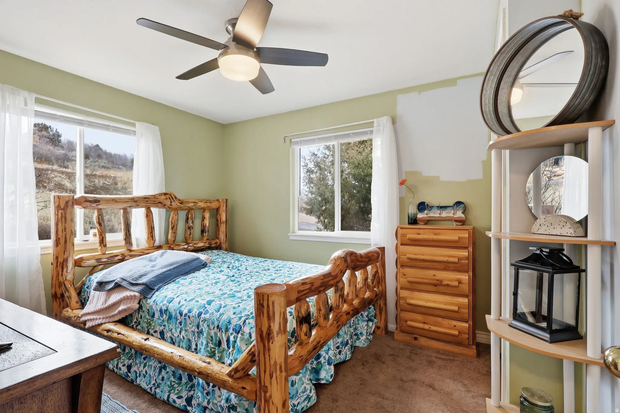 Bedroom featuring carpet flooring and a ceiling fan