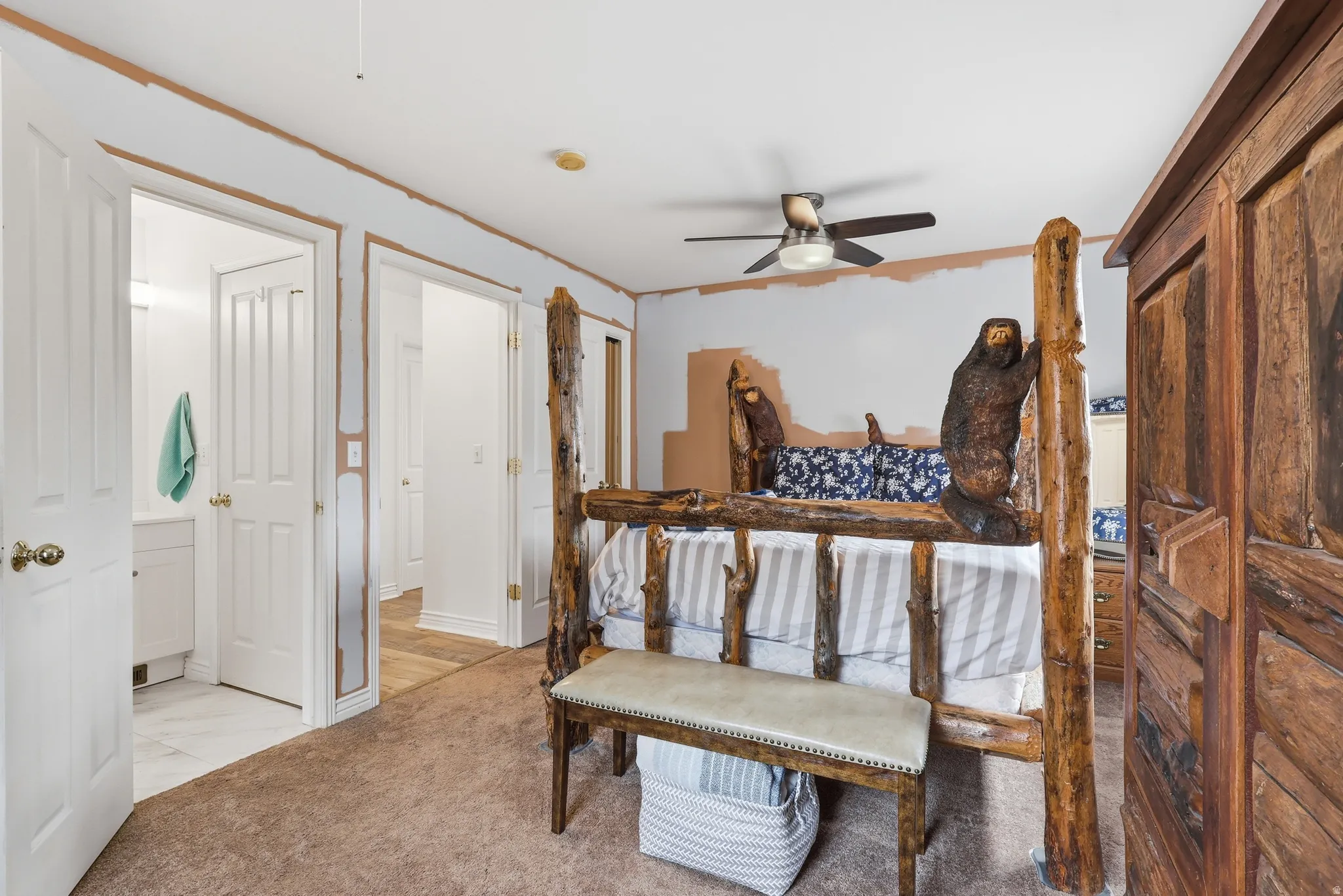 Bedroom featuring light carpet, crown molding, and ceiling fan