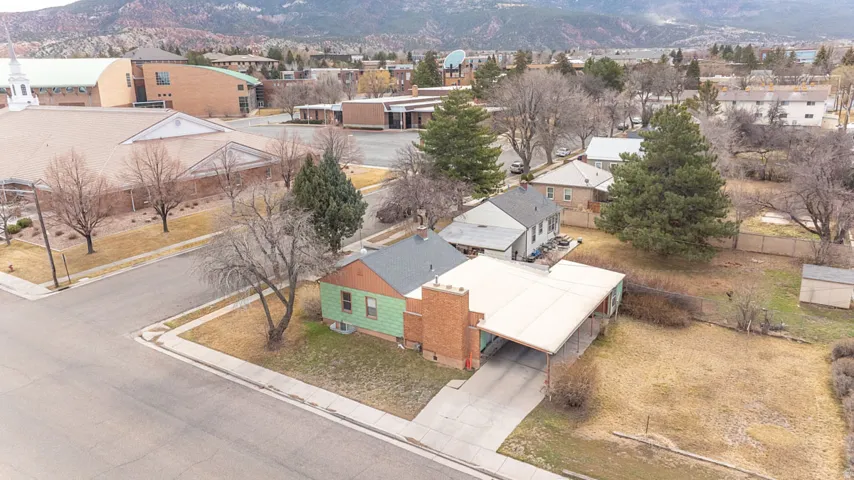 Aerial perspective of suburban area with a mountainous background