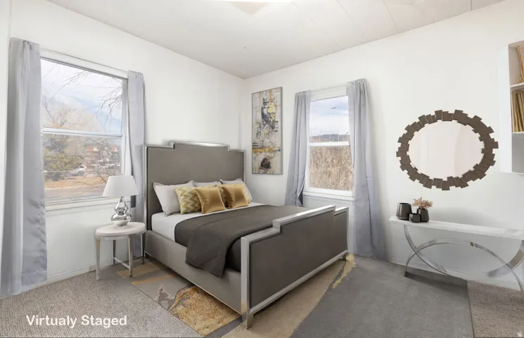 Carpeted bedroom featuring baseboards