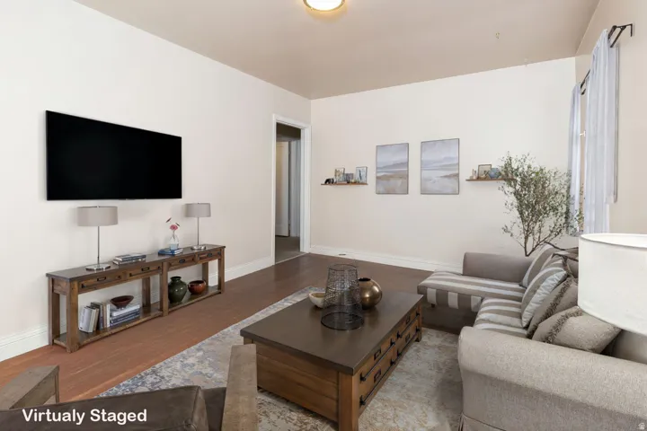 Living room with wood finished floors and baseboards