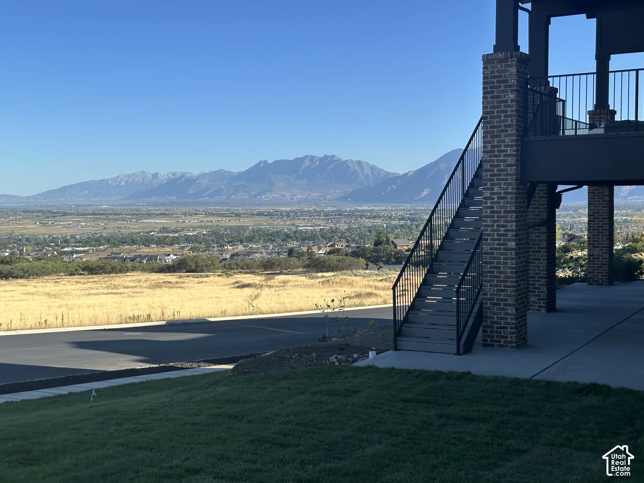 Expansive mountain scenery with a distant city landscape